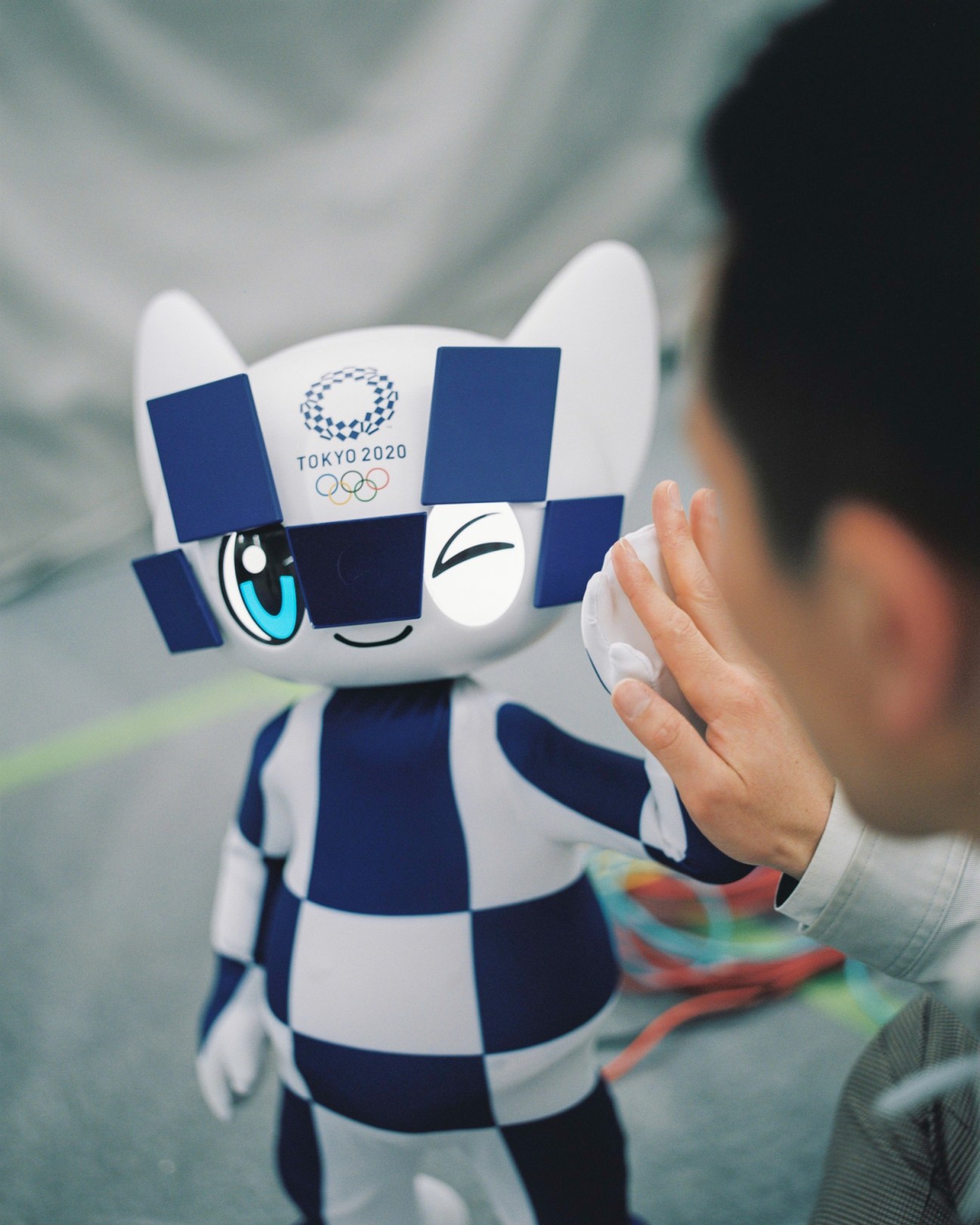 Close-up view of the robotic Olympic mascots showing their sophisticated design and technology
