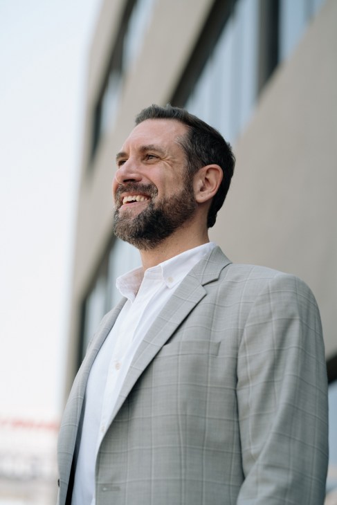 Massimo Casagrande, academic director of Istituto Marangoni Miami, smiles at the camera wearing a light grey blazer and white shirt.