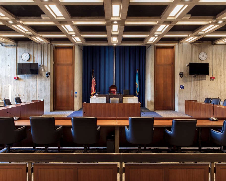 Interior view of Boston City Hall's Council Chamber showing concrete walls and modernist design elements