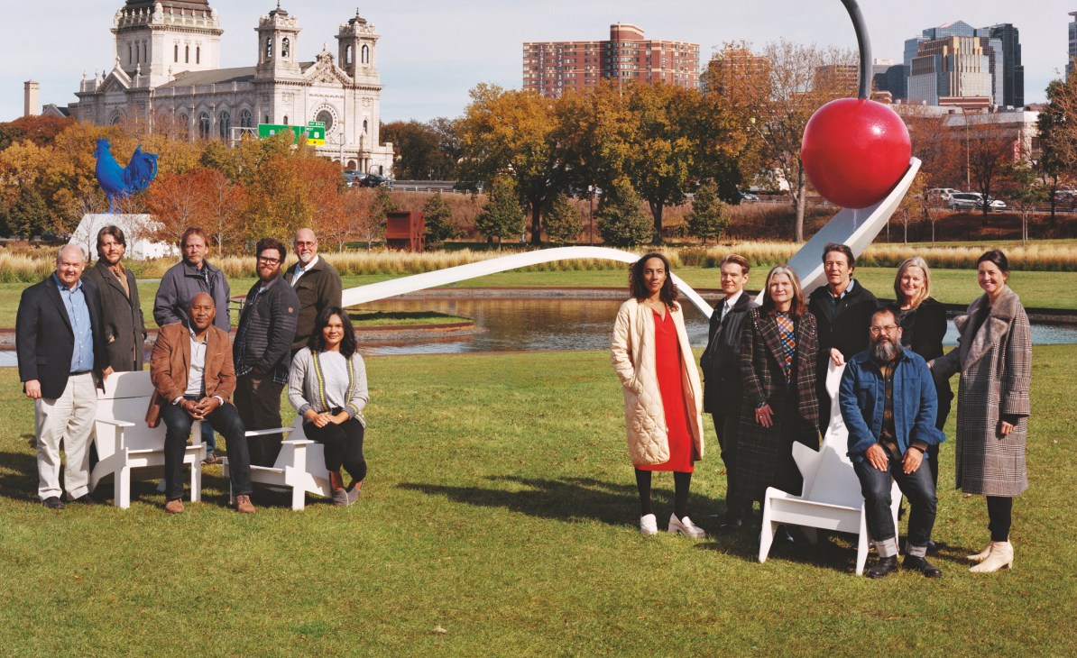 Walker Art Center team members pose outdoors in Minneapolis sculpture garden with Spoonbridge and Cherry artwork