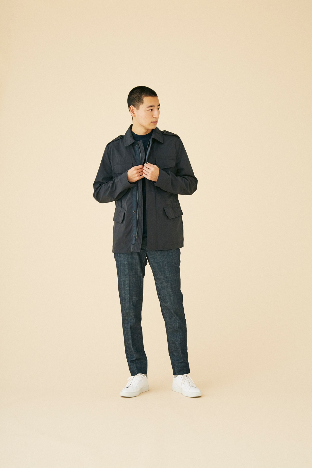 Man wearing sleek jacket by Montedoro against clean background