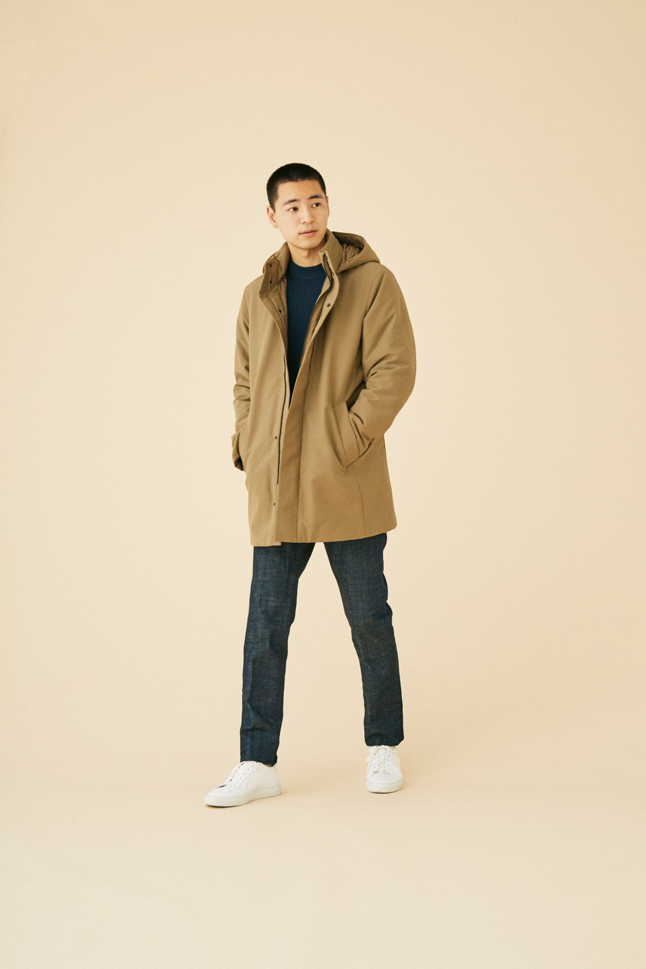 Man wearing accessible coat by Uniqlo in contemporary styling