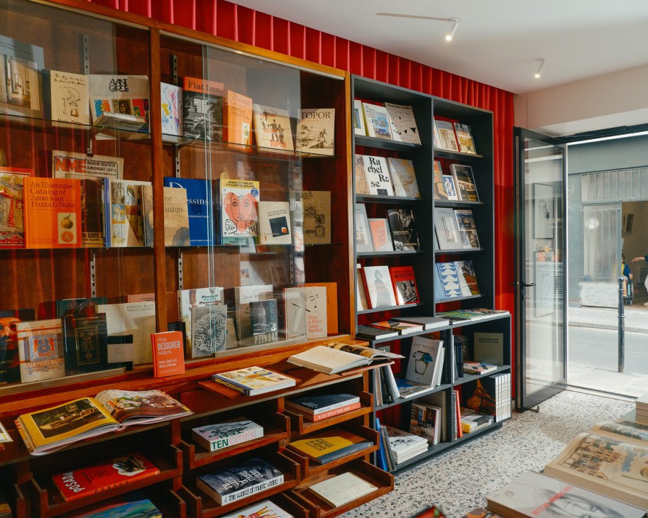Interior of Rupture Records in Paris showing book displays, shelving units, and modern design elements