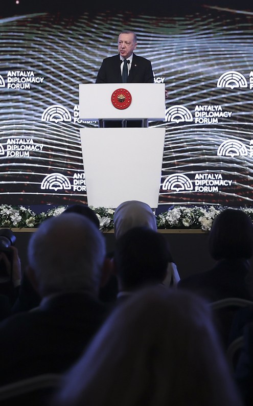 Turkish Foreign Minister Mevlut Cavusoglu speaking at podium during the Antalya Diplomacy Forum