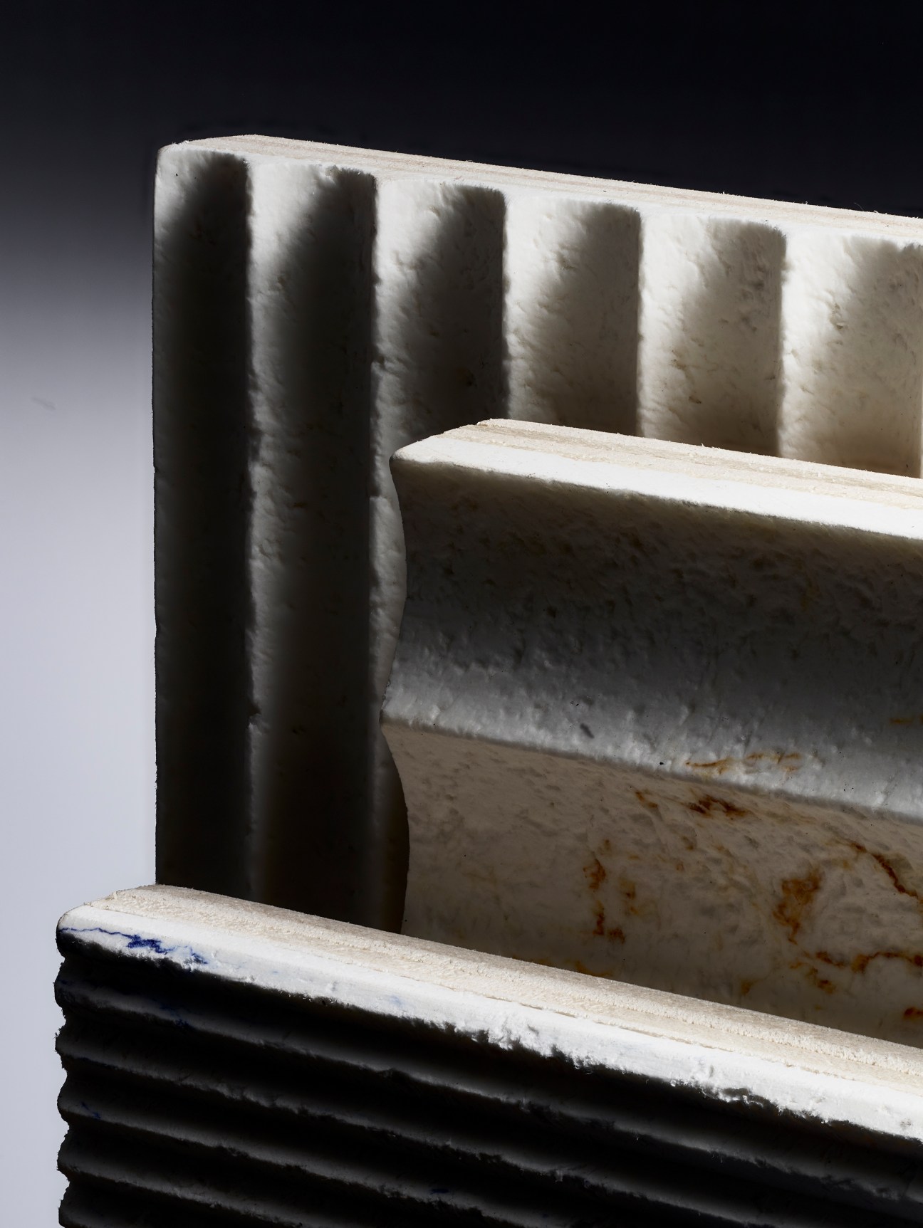 Paper Factor's papier-mâché interior surface panels showing textured white material samples with ridged surfaces