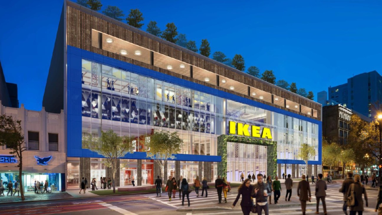 Modern multi-story IKEA store with large glass windows and people walking outside at dusk