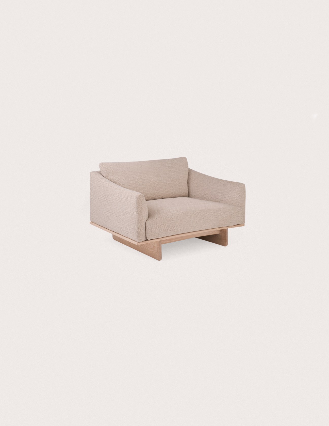 Grade sofa by Jonas Wagell for L Ercolani with beige upholstery and wooden base on neutral background
