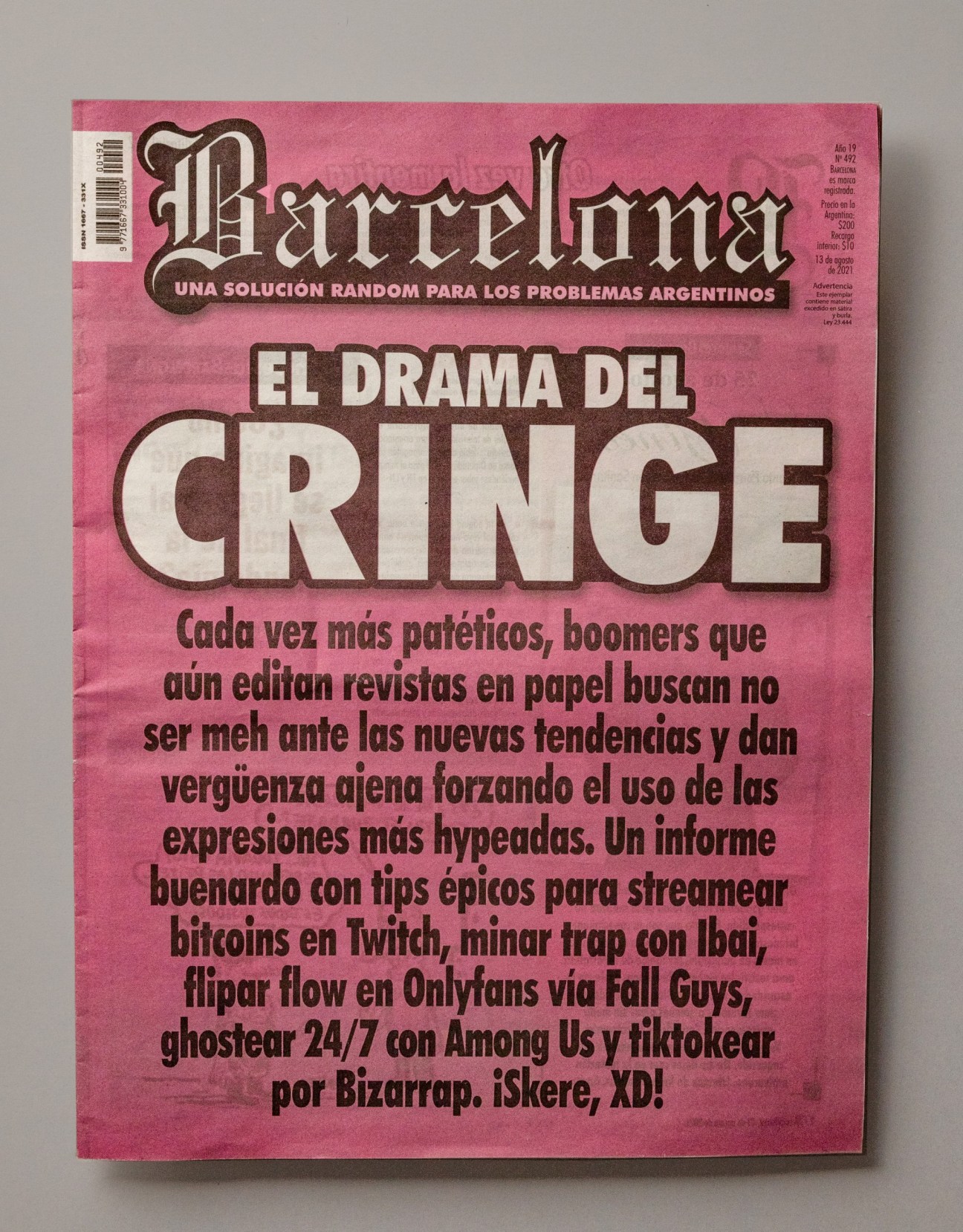 Cover of Barcelona magazine with pink background and brown text about internet cringe culture.