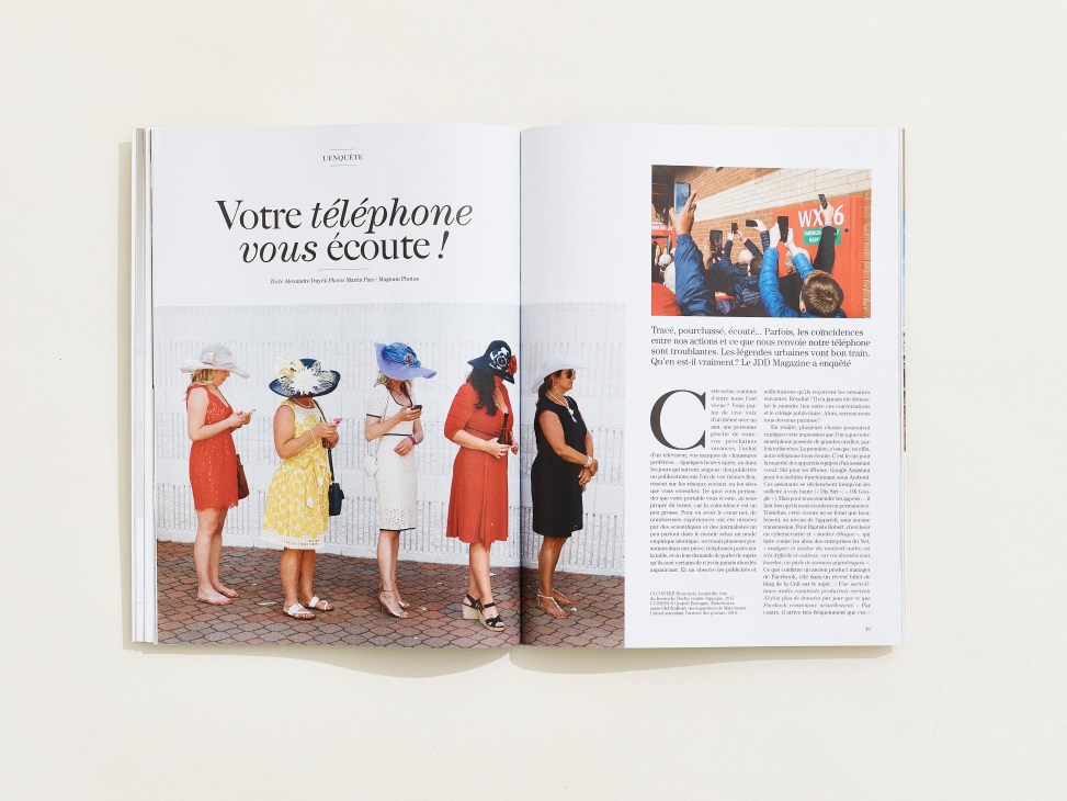 Open magazine spread showing article titled 'Votre téléphone vous écoute!' with women using phones