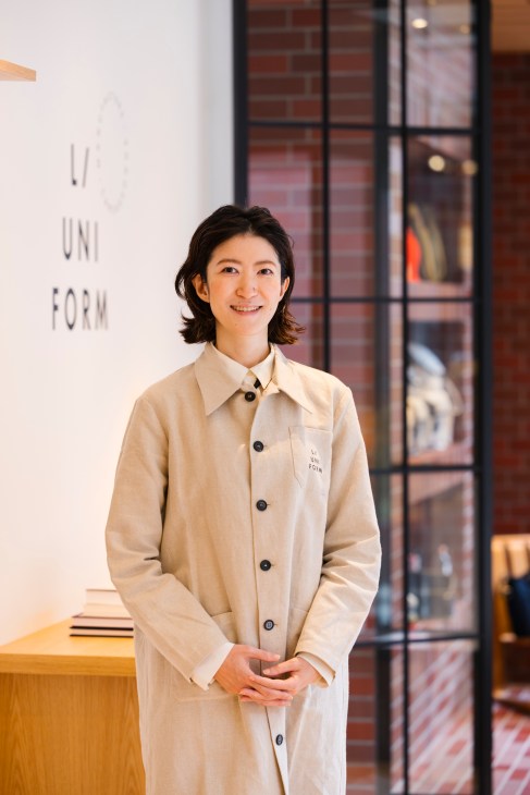 Takako Asakura, Japan merchandising director, standing in L/Uniform Tokyo store