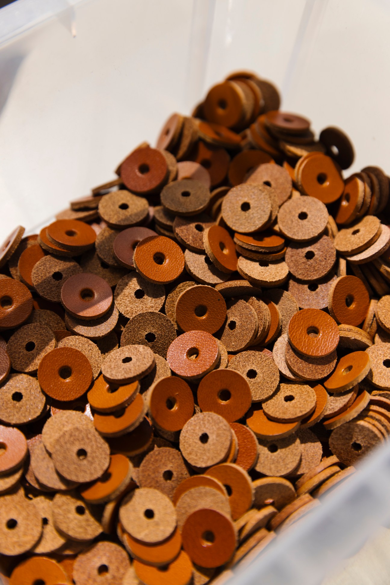 Close-up of metal rivets and hardware details on leather goods