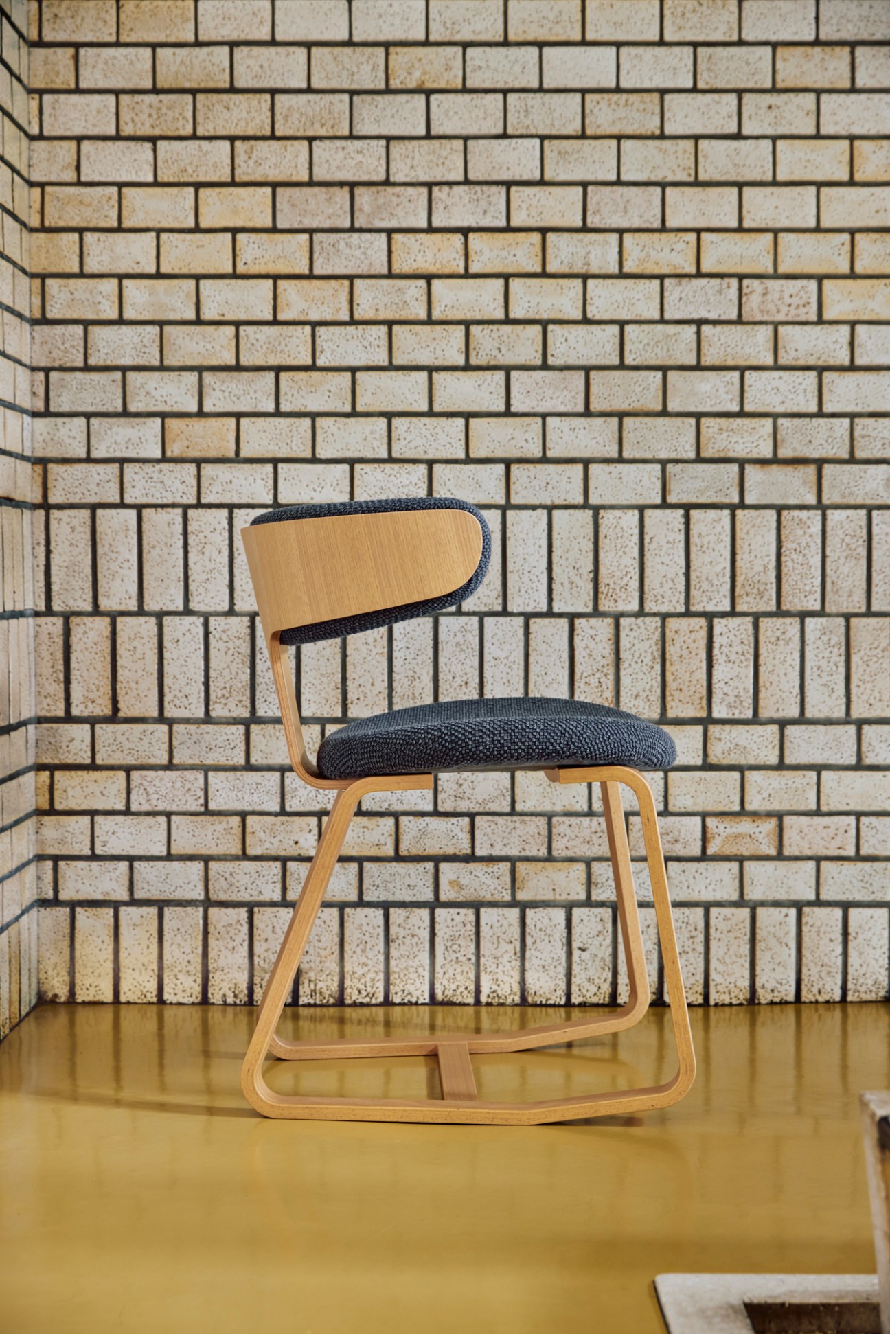 Tendo Swing Chair by Hiroshi Nakamura featuring curved moulded plywood back with oak and white beech construction