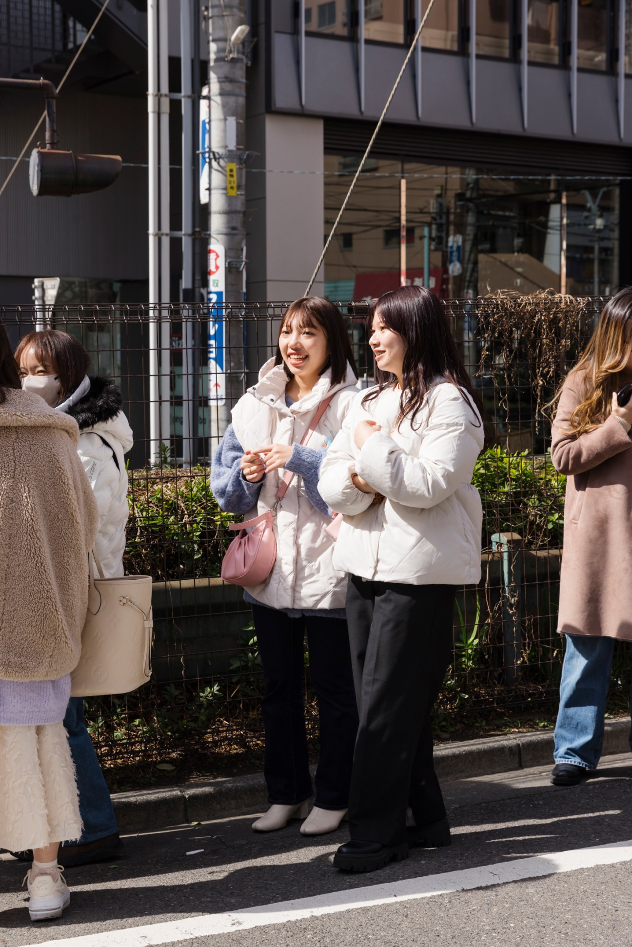 Two women approaching entrance