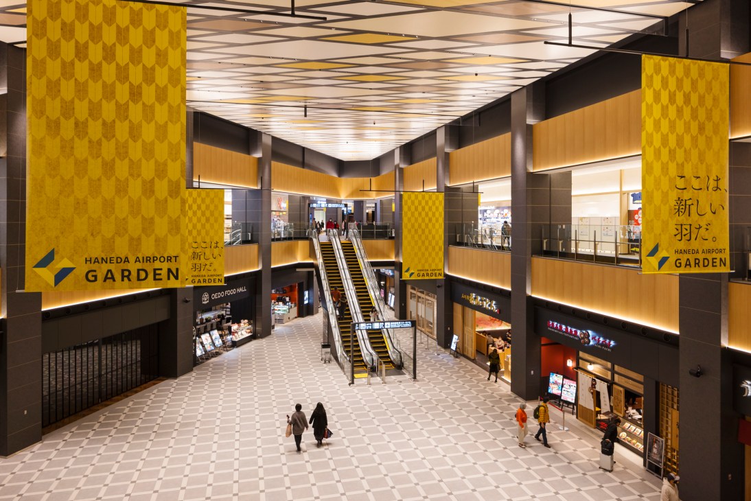 Exterior view of modern Haneda Airport Garden complex with retail and hotel facilities