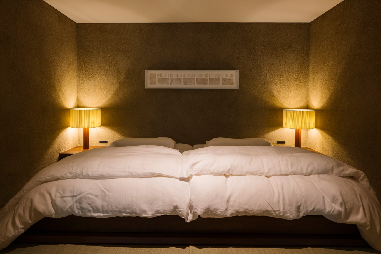 Interior view of a Western-style bedroom at Auberge Tokito featuring modern furnishings and traditional Japanese elements