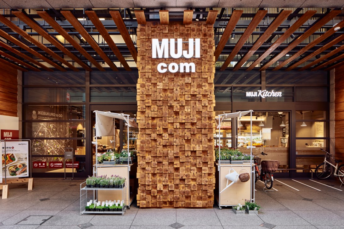 Interior of Muji convenience store with shelving, food displays and retail layout