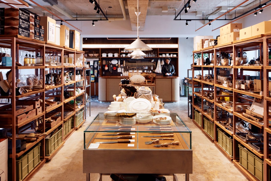 Display of various homeware items including glasses, brushes, and kitchen accessories