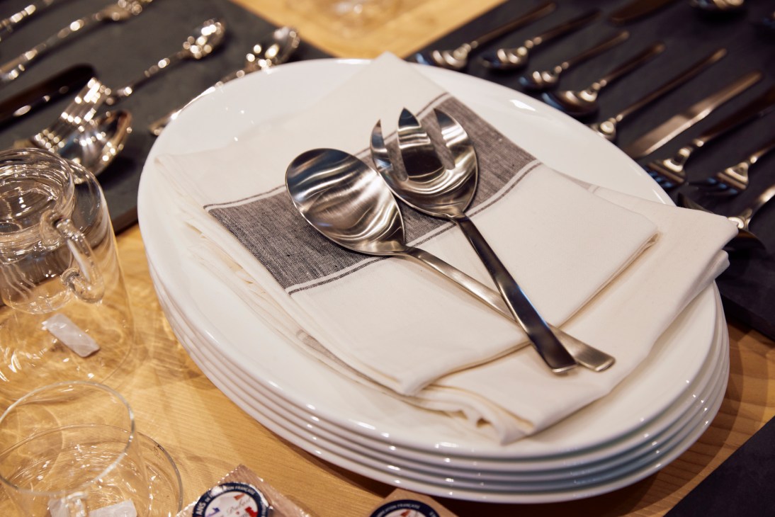 White bone china plates and bowls from Nikko's Remastered series with stainless steel flatware