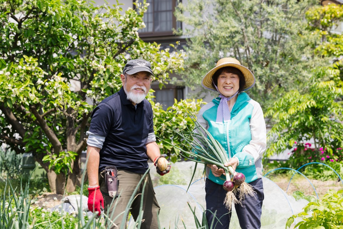 Hitoshi Sogawa and Sachiko Taniguchi working together in the community space