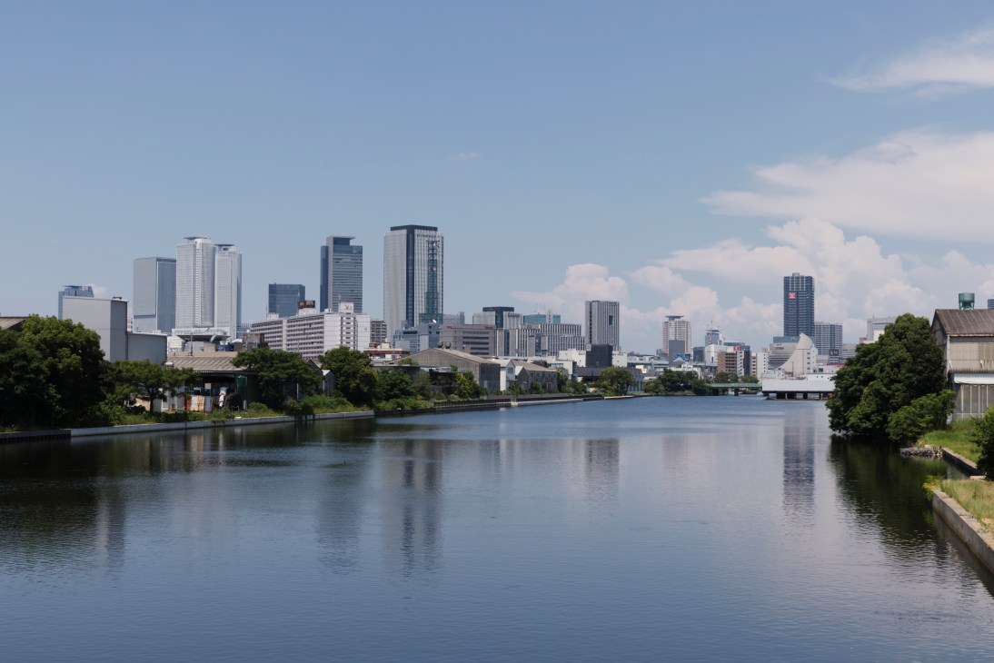 Modern architecture of Vermicular Village with large windows overlooking a river in Nagoya