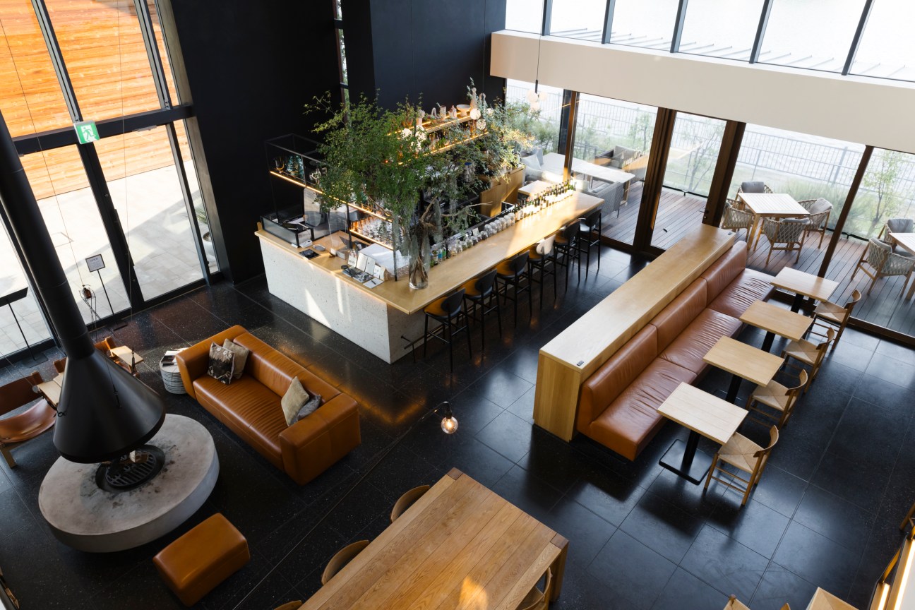 Interior of The Foundry restaurant with modern design and large windows overlooking water