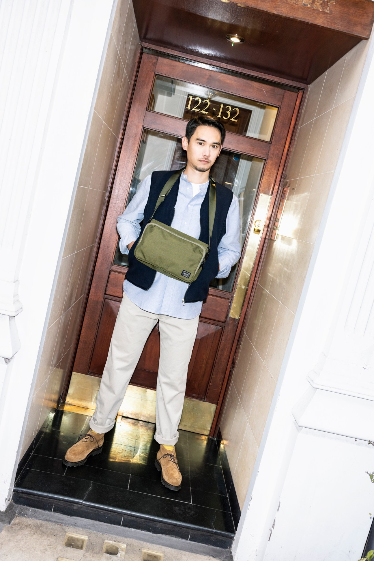 Benson Batty wearing Porter city bag in olive