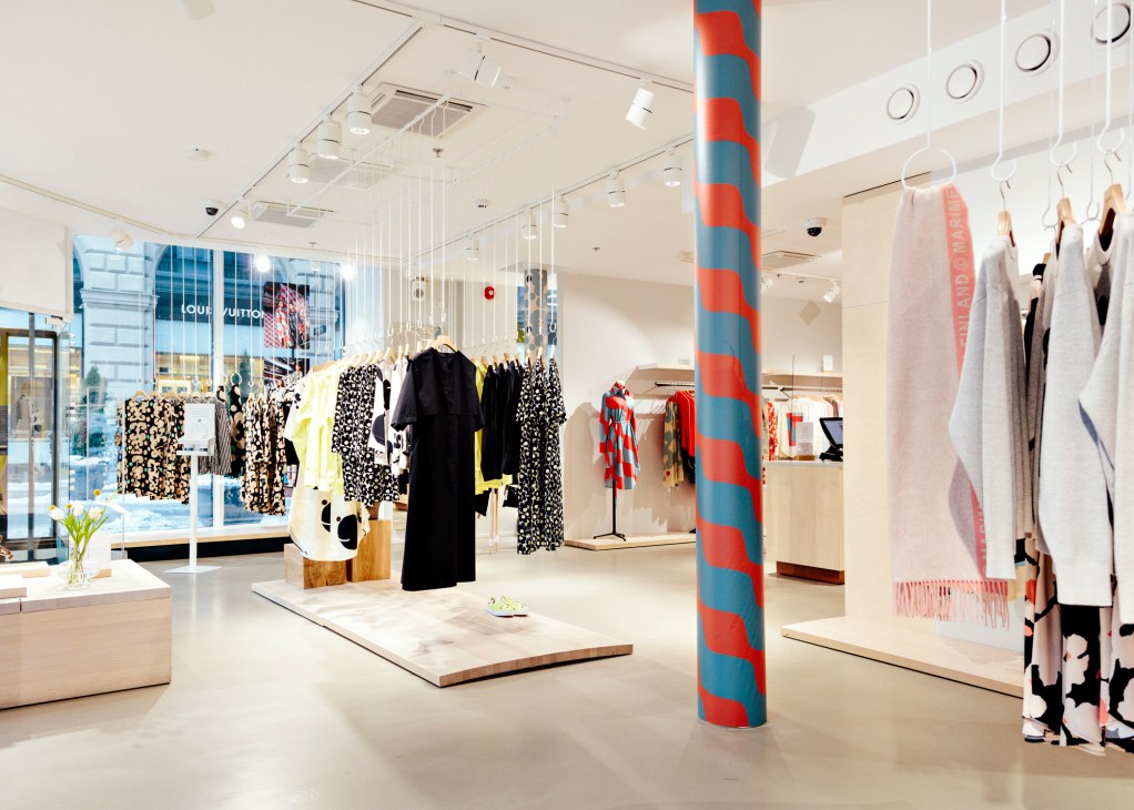 Interior of Marimekko shop in Esplanadi, Helsinki showing white retail space with colorful striped column