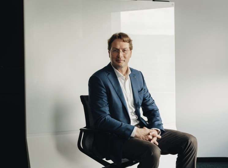 Ola Källenius, chairman of Mercedes-Benz, sitting in a modern office environment during the interview