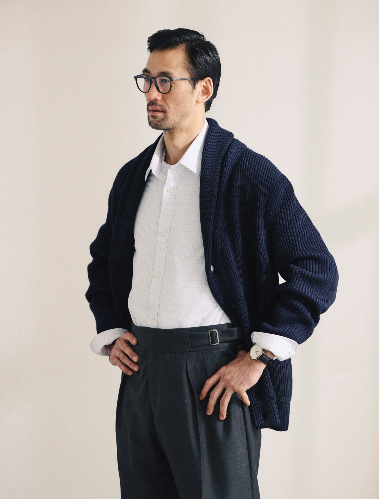 Cardigan, shirt and trousers by Dunhill, t-shirt by Cahlumn, glasses by Mykita, patrimony automatic watch by Vacheron Constantin