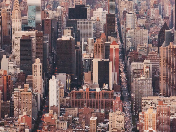 Aerial view of densely packed Manhattan skyscrapers and buildings stretching to the horizon.