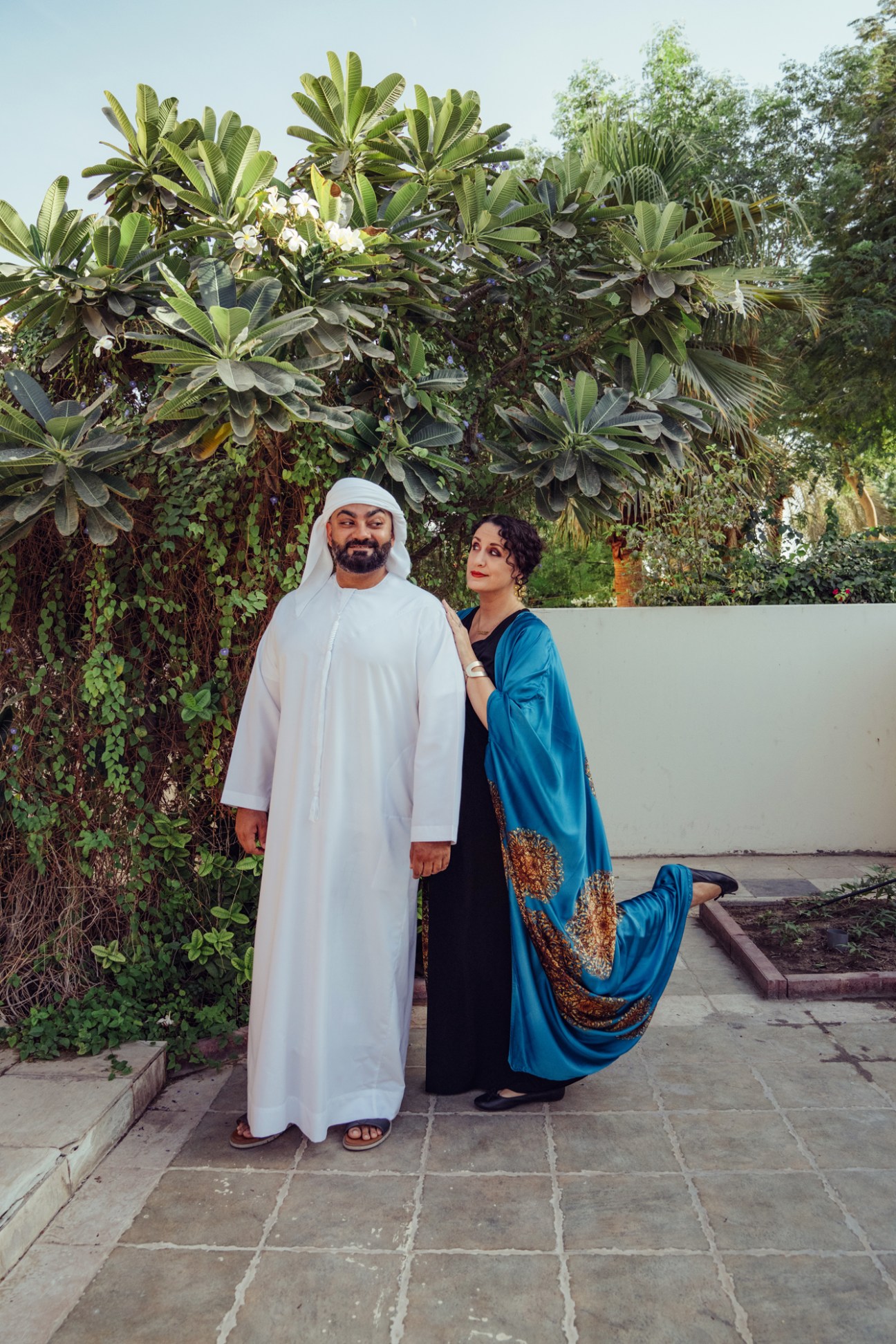 Ali Al Sayed and Mina Liccione pose together in a garden setting in Dubai