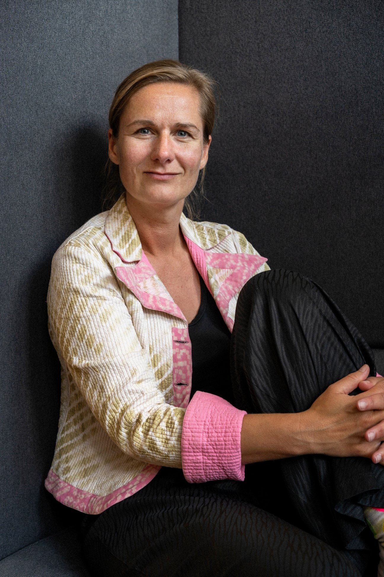 Linda Olsen, radio producer and presenter, sitting in professional portrait pose