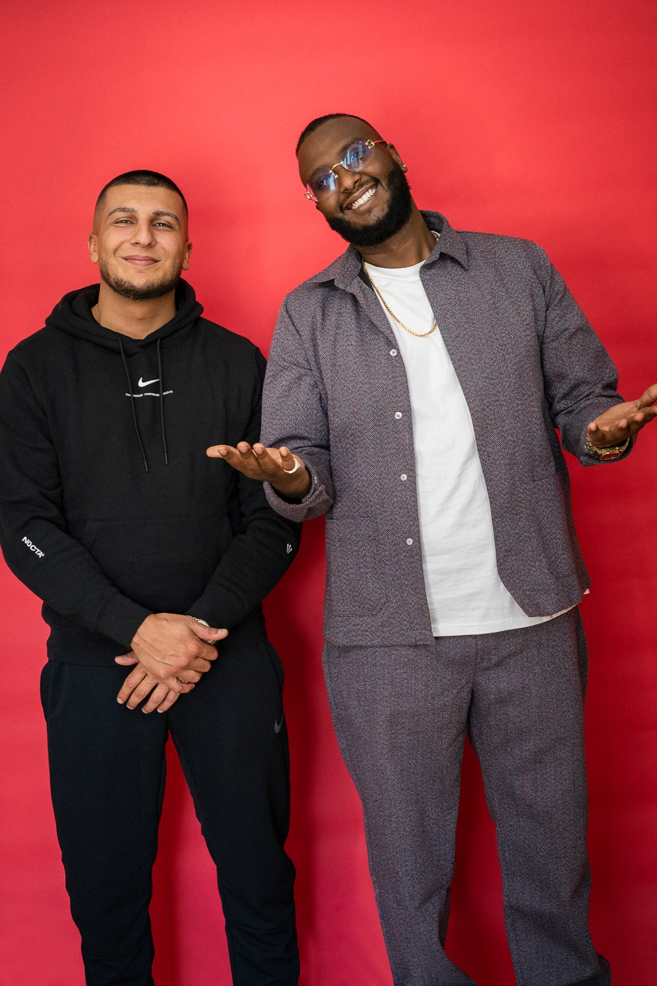 Danish duo Hav Shennabaz and Kamal Hassan posing against a red background.