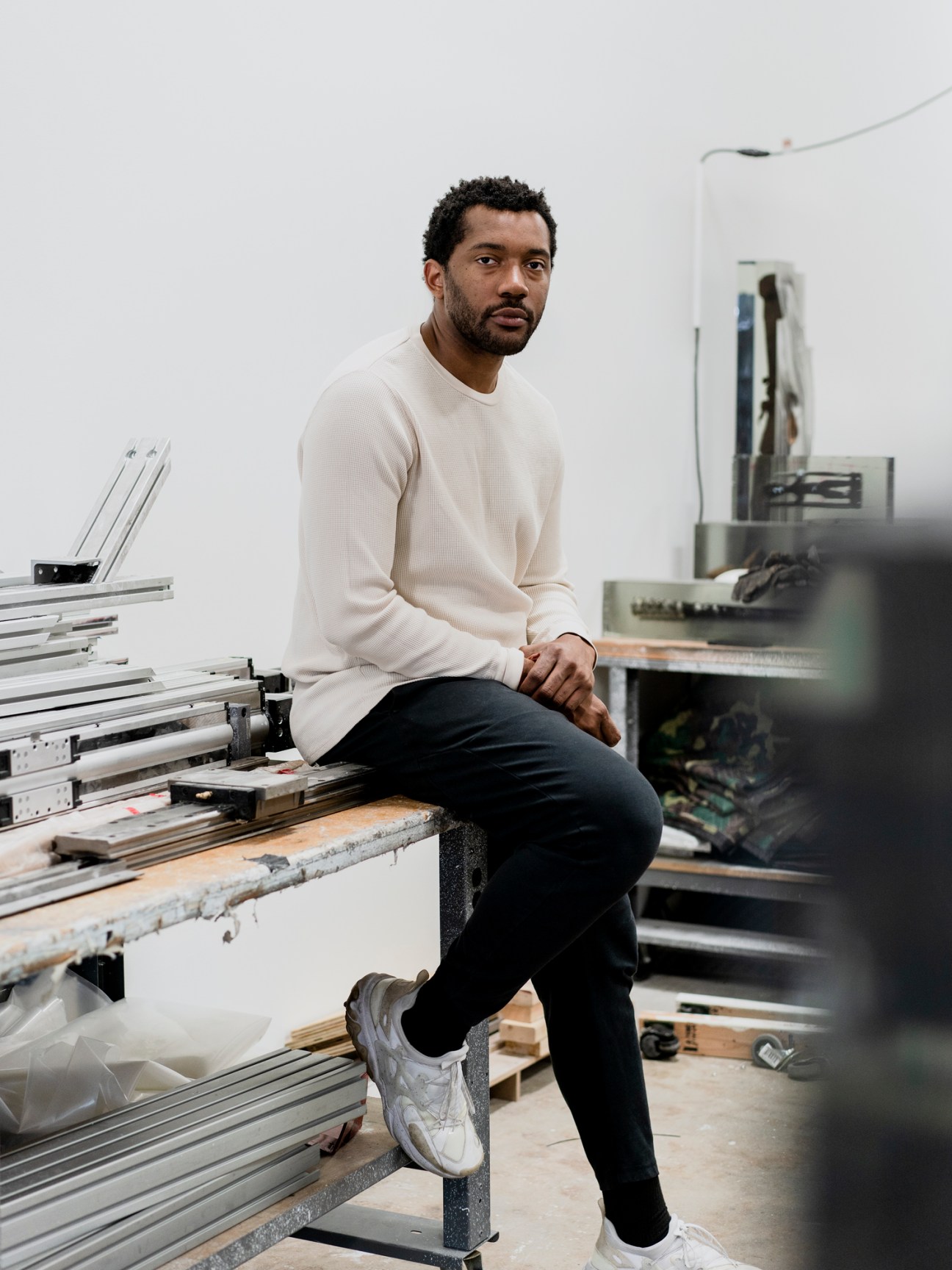 Artist Matthew Angelo Harrison working in his studio