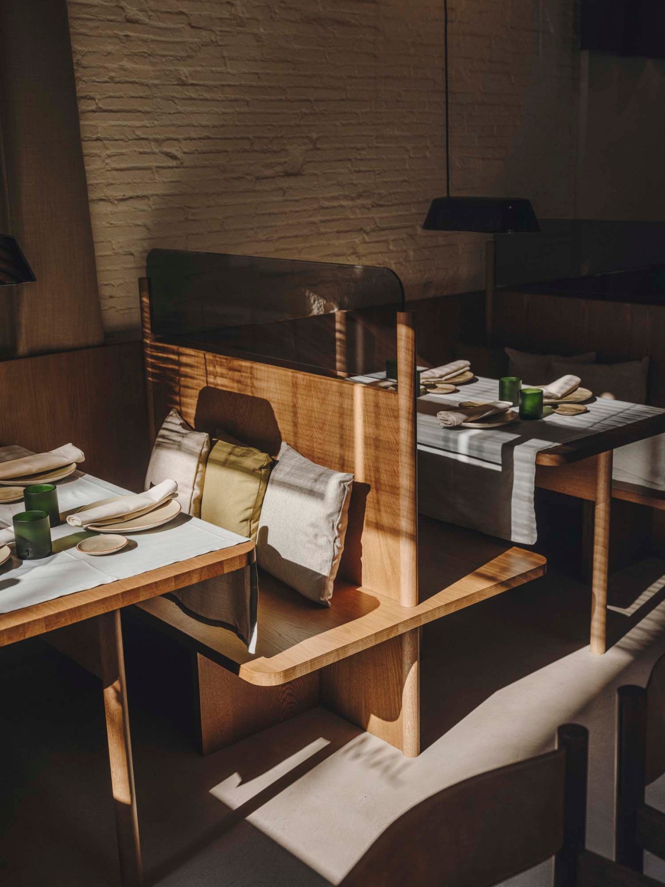 Interior view of Normal restaurant showing booth seating design that demonstrates functional yet attractive dining spaces