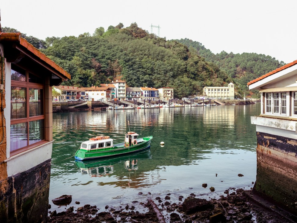 Casa Cámara exterior showing harbourfront location with traditional fishing village backdrop
