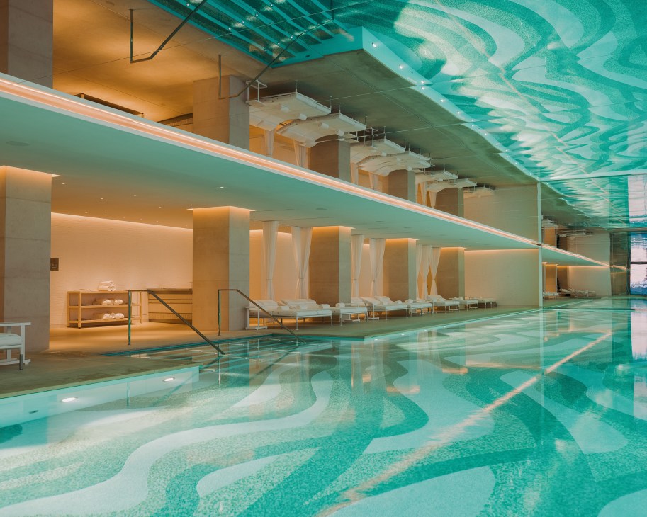 The Dior spa 30-metre pool at Le Cheval Blanc hotel with turquoise water and digital artwork ceiling.