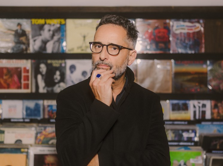 Jorge Drexler browsing vinyl records at Permanent Records in northeast Los Angeles