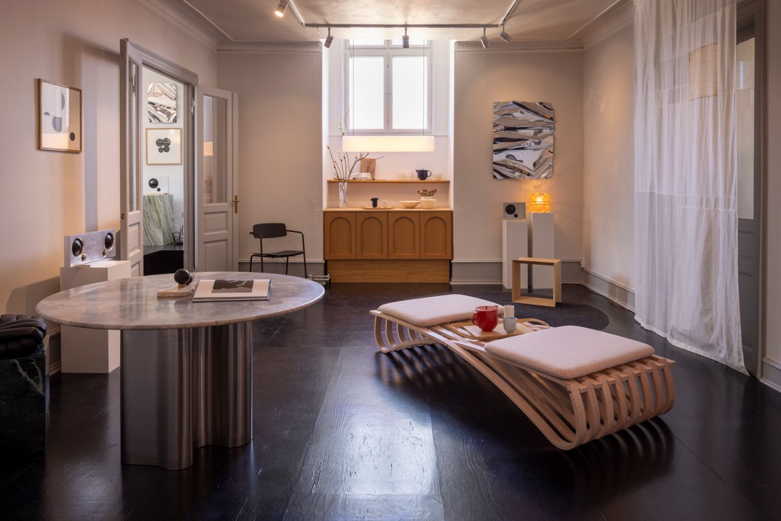 Decorative objects and lighting displayed on shelves in a modern interior space