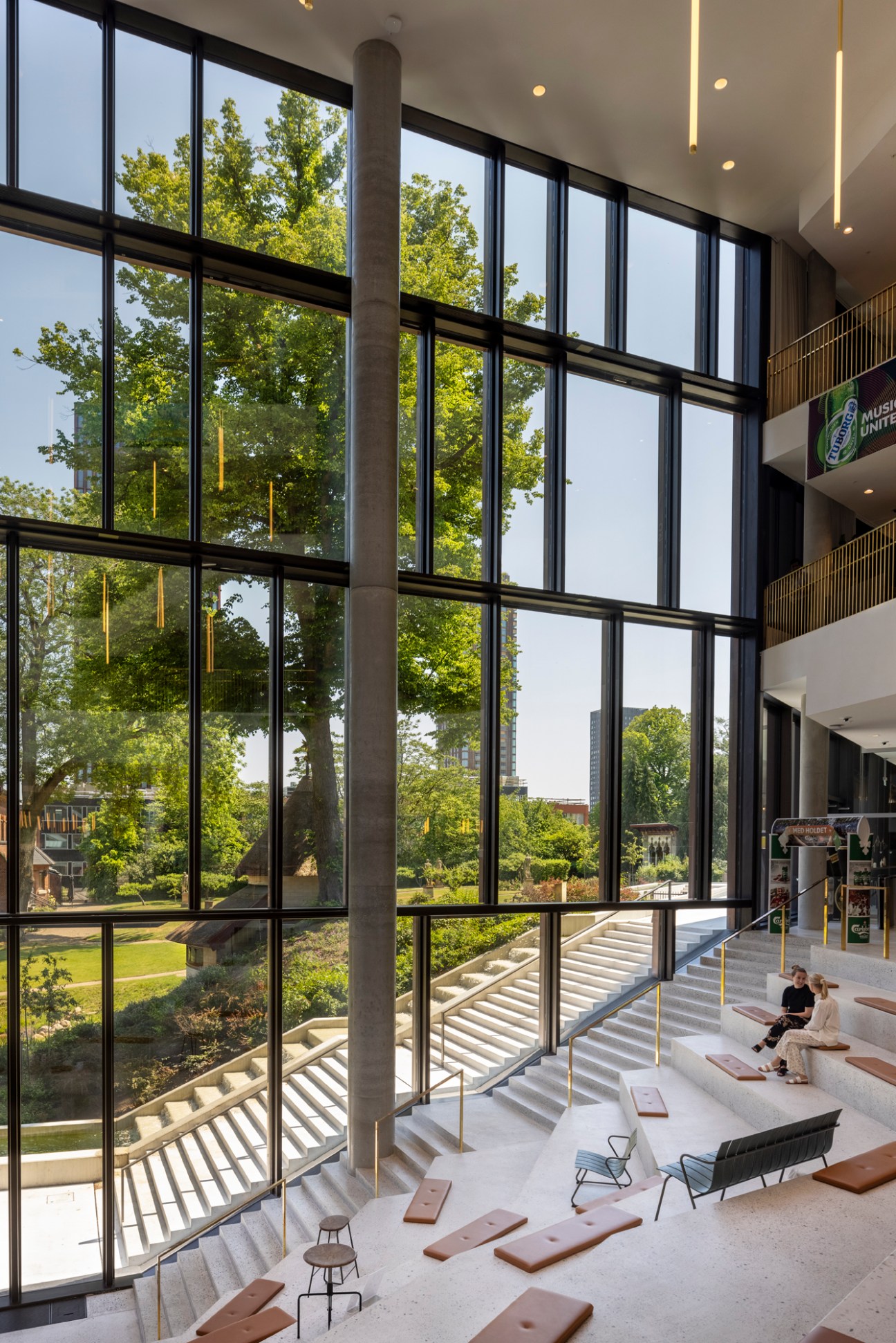 Interior view of Carlsberg's Copenhagen headquarters showing natural light, timber finishes and modern workspace design