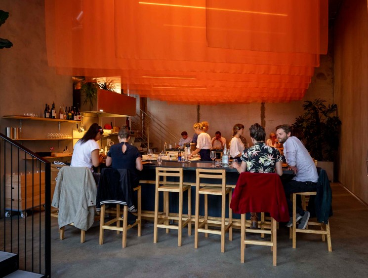 U-shaped ramen bar at Kona with modern design and counter seating