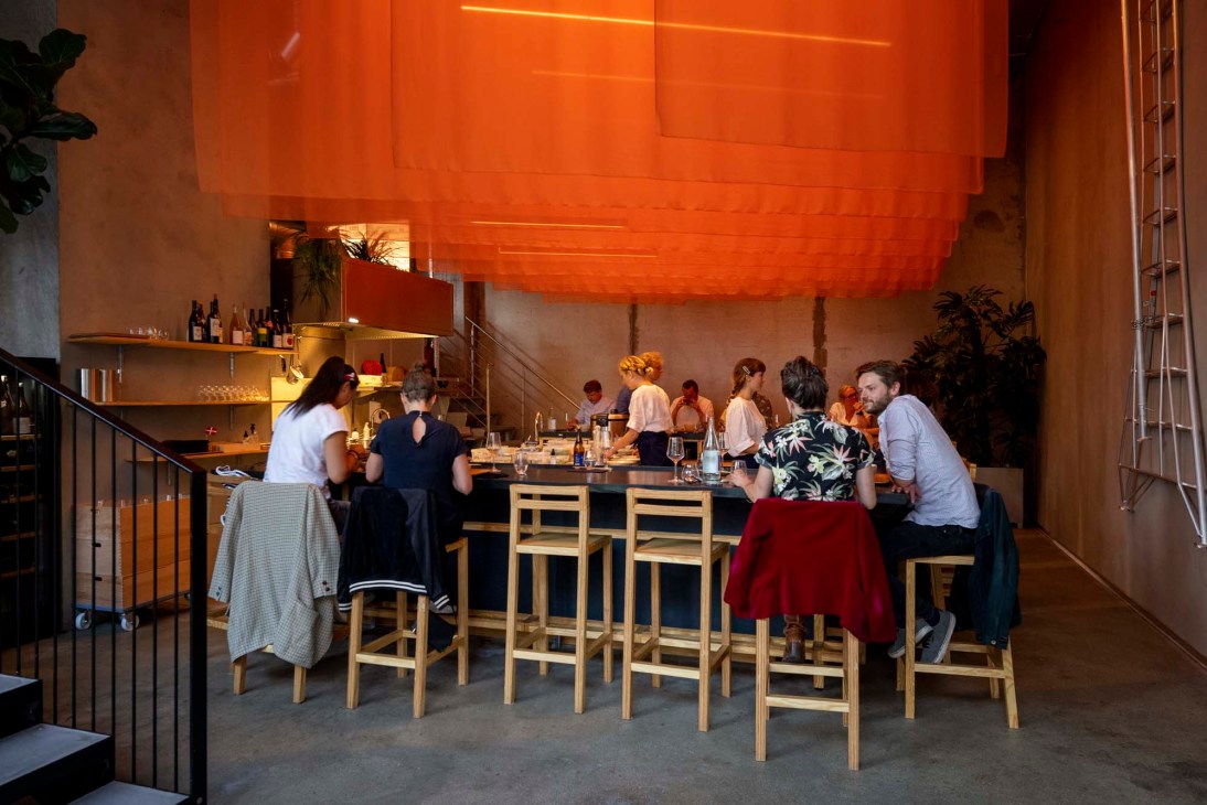 U-shaped ramen bar at Kona with modern design and counter seating