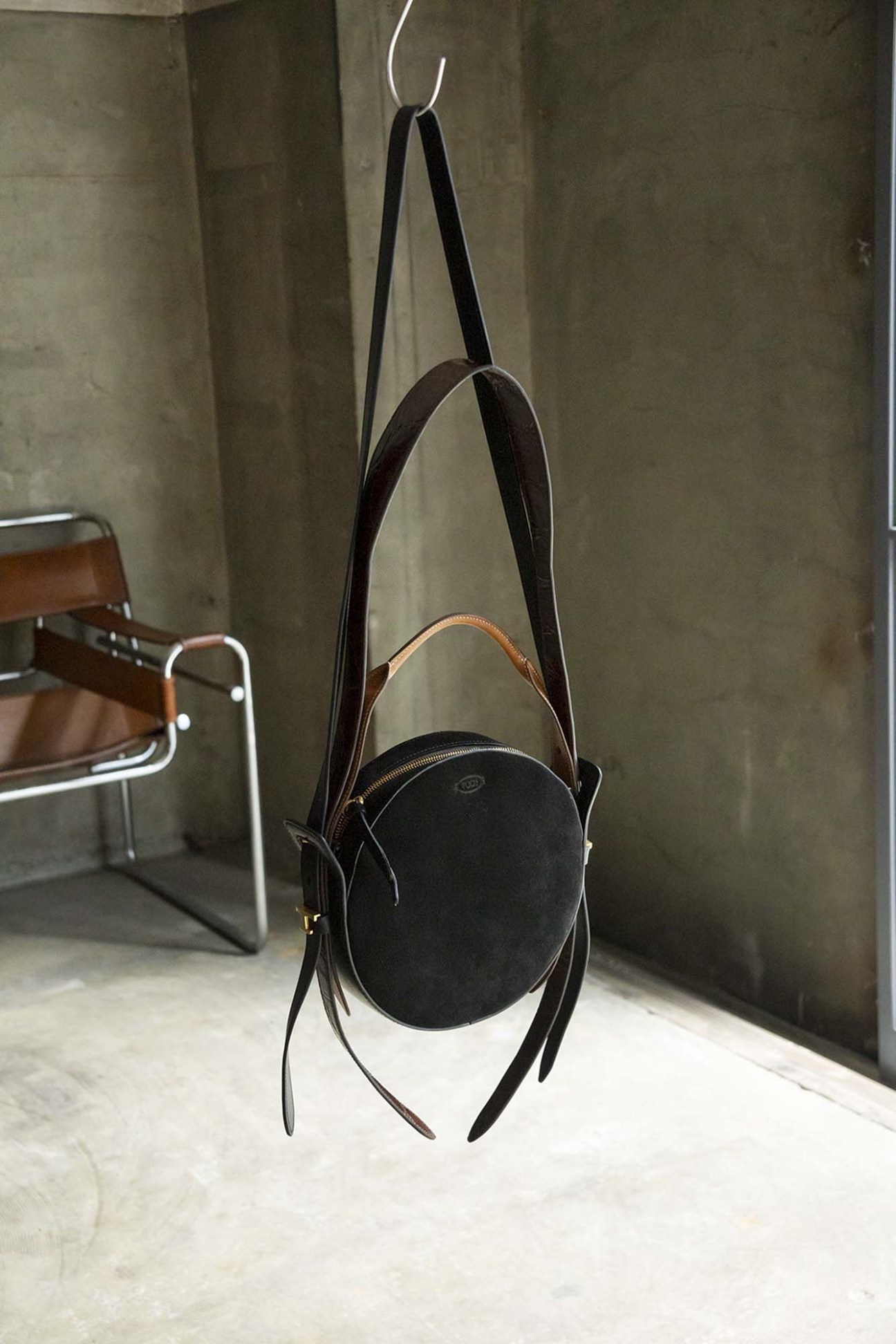 Tod's x Hender Scheme collaboration leather bag with circular dot-inspired design and brown straps