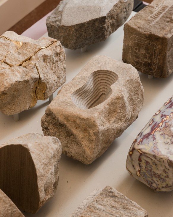 Close-up view of various building materials and textures including concrete, metal, and composite samples