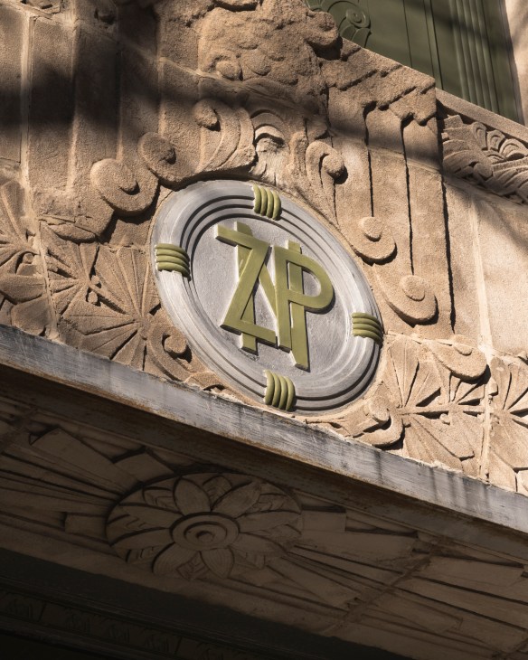 Historic architectural details and decorative elements preserved from the building's previous life as a Polish credit union