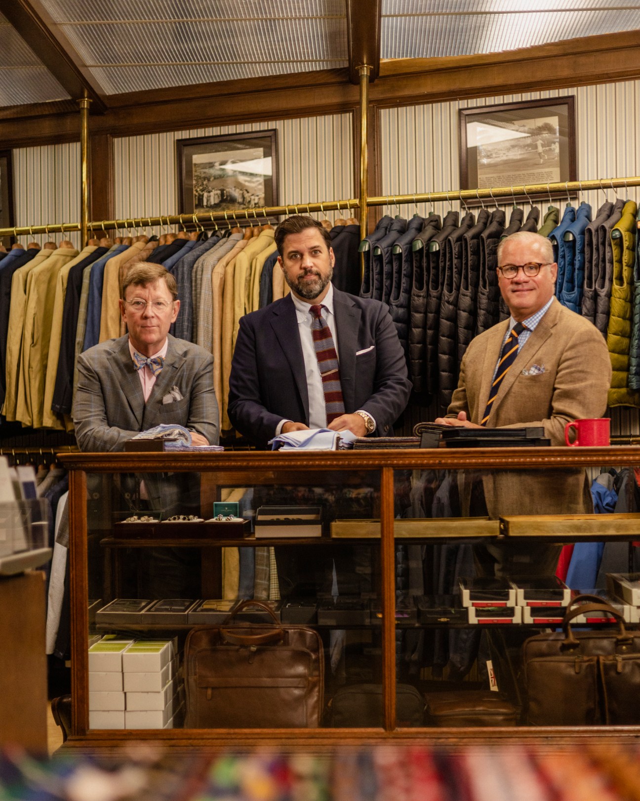 Three men from Harrison Limited standing together in their store