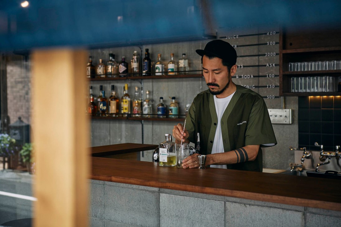 Soran Nomura behind the counter at his next-generation liquor shop in Tokyo