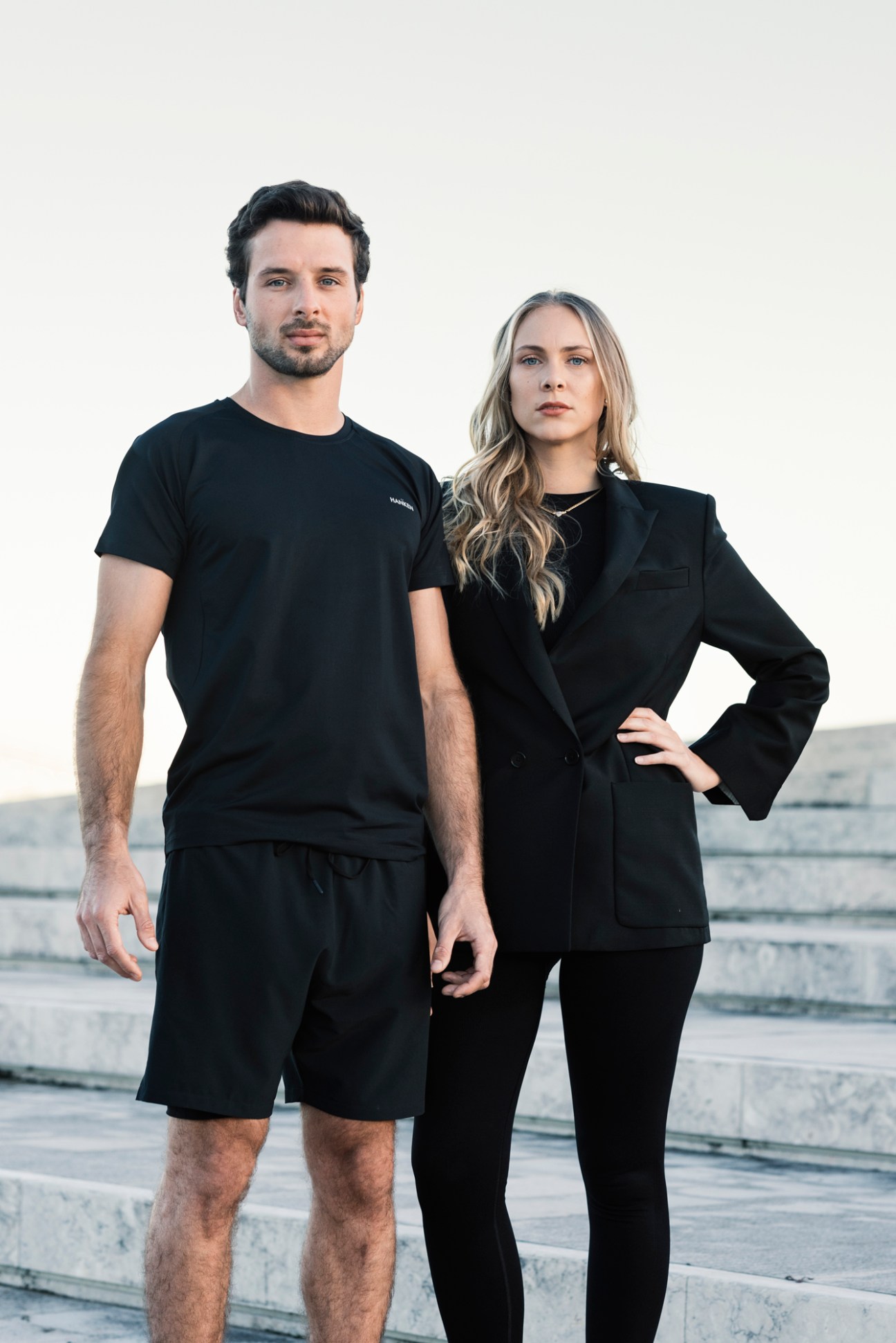 Pedro Stürken and Maria Hansen, founders of Hanken activewear brand, standing together in black clothing