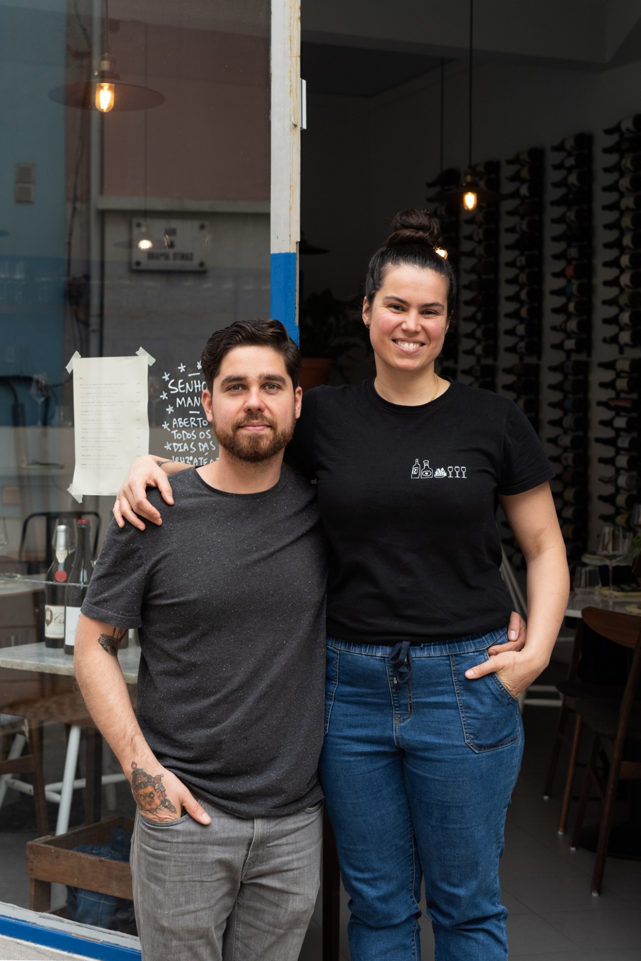 Marc Davidson and Stéphanie Audet standing together in their wine bar Senhor Manuel