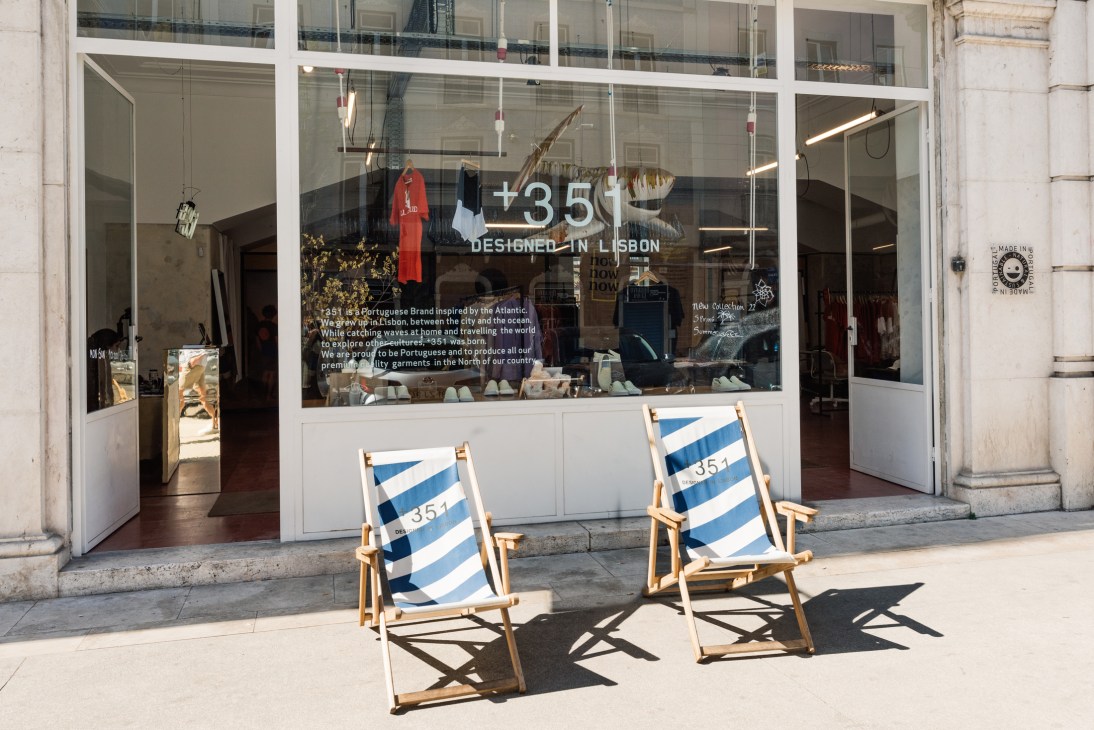 Two blue and white striped deckchairs positioned outside 1351 store entrance